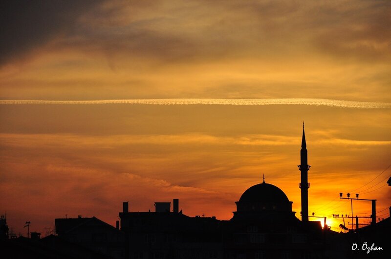 Sunset over a mosque silhouette