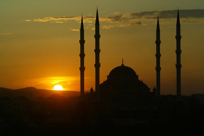 Sunset over a mosque silhouette