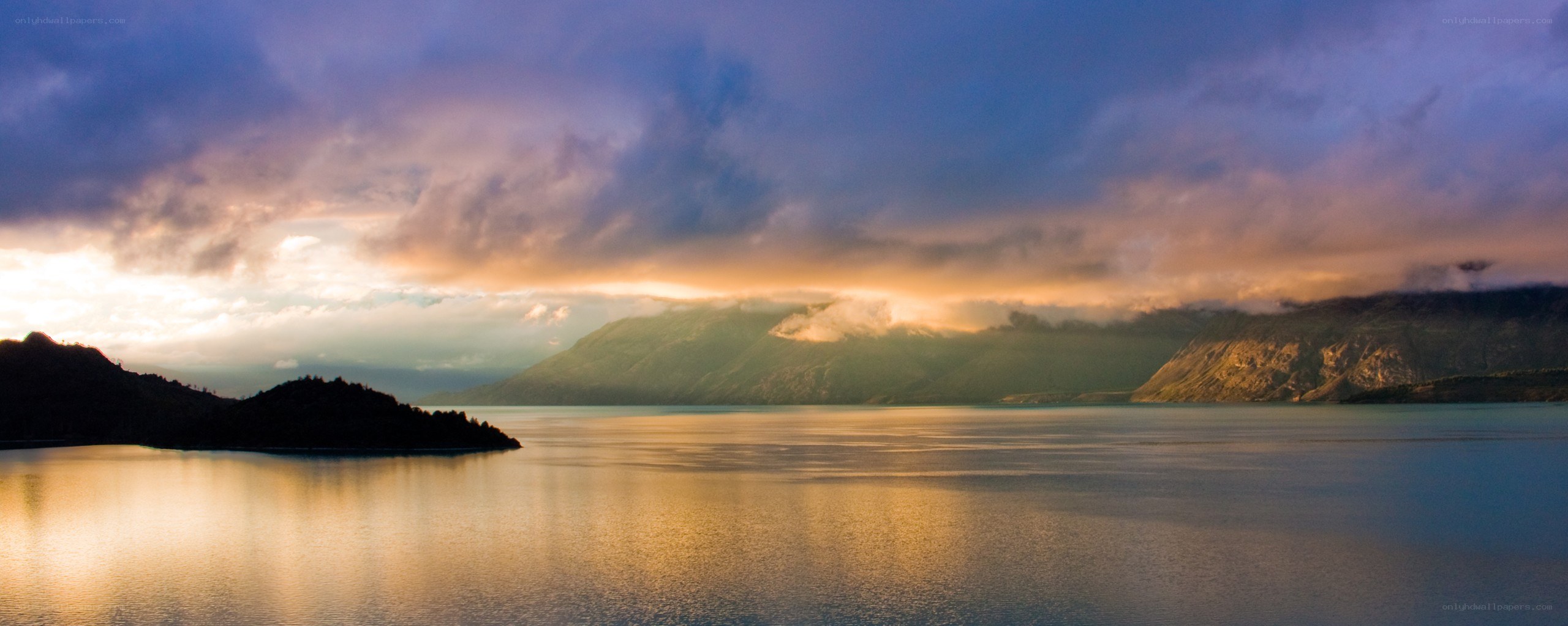sunset over a mountain lake