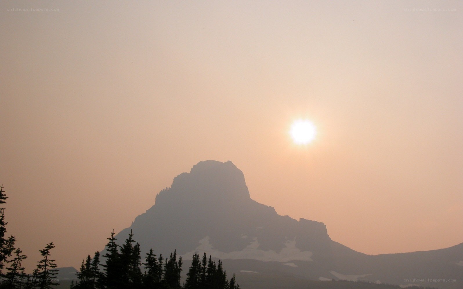 Sunset over a mountain silhouette