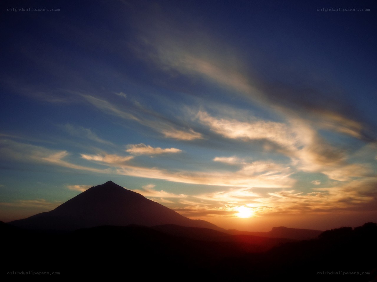 Sunset over a mountain silhouette