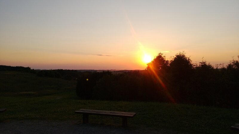 Sunset over a park bench