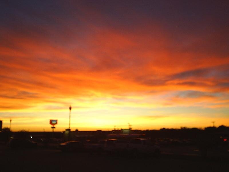 sunset over a parking lot