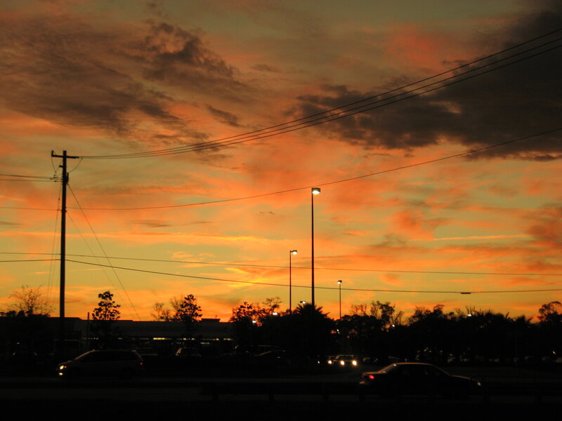 sunset over a parking lot