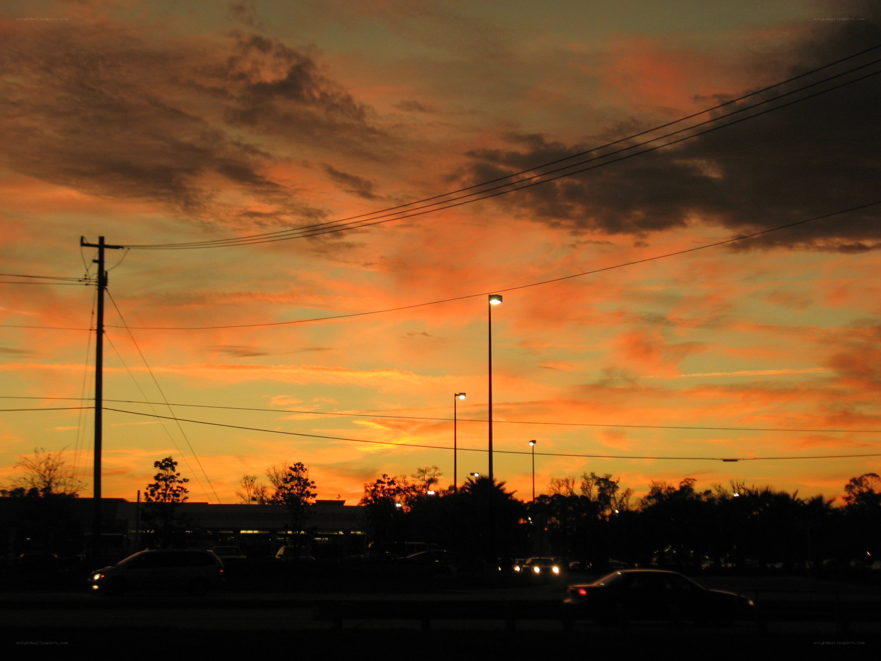 sunset over a parking lot