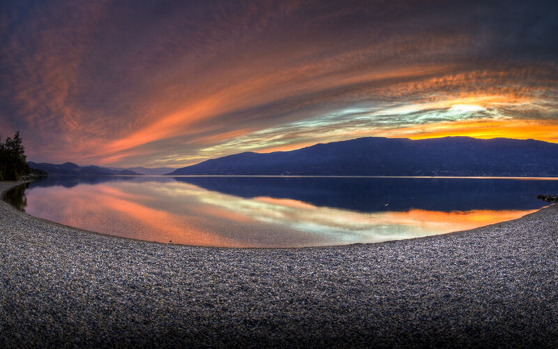 Sunset over a pebble beach