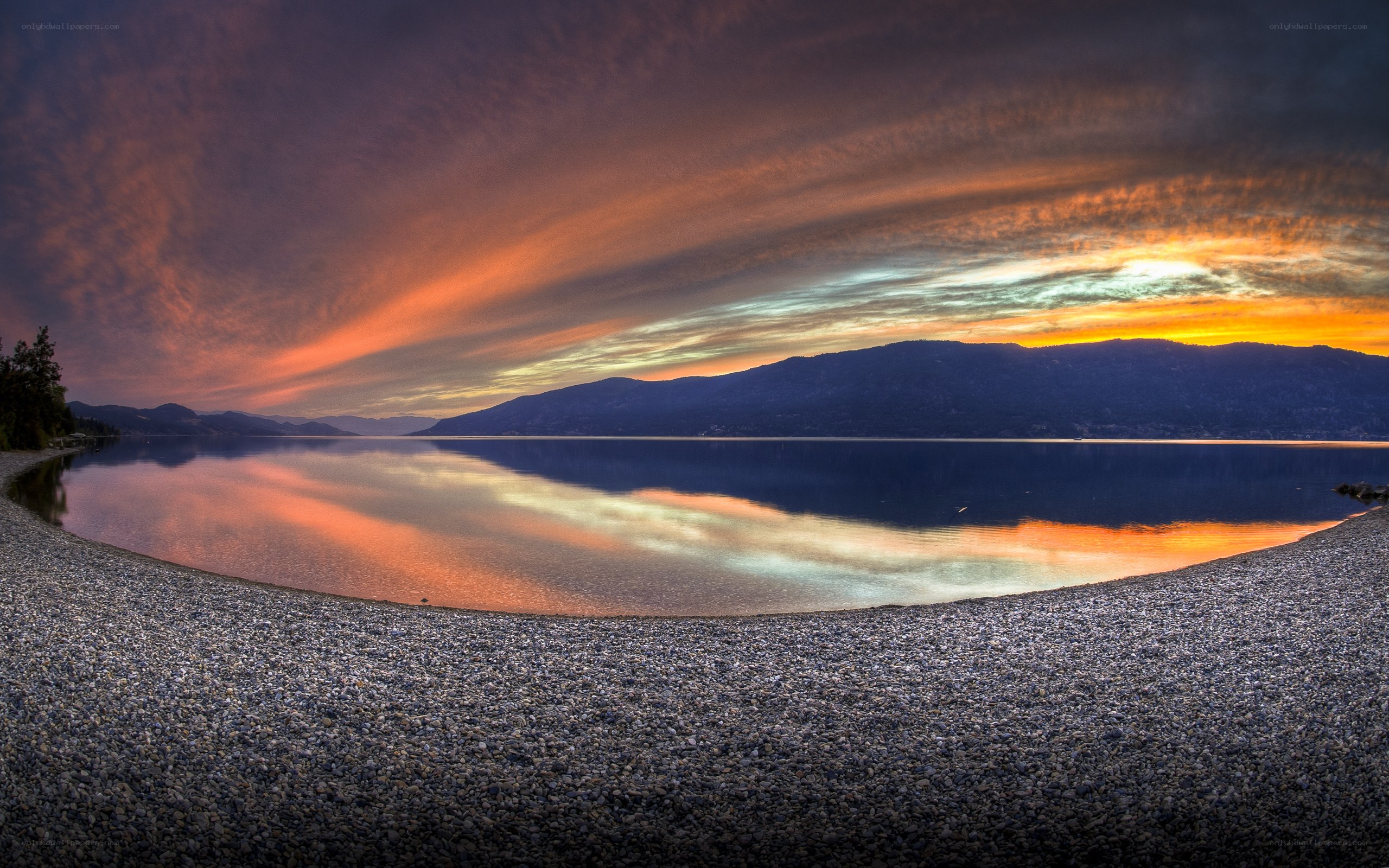 Sunset over a pebble beach