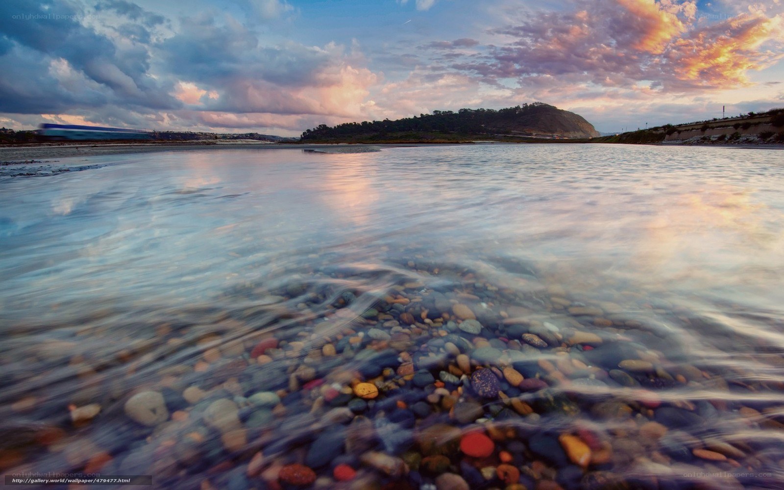 Sunset over a pebble beach