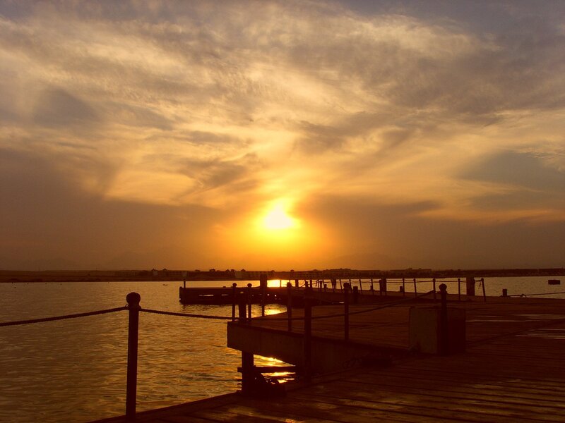 Sunset over a Pier — Orange, Serene, Photograph, Sun