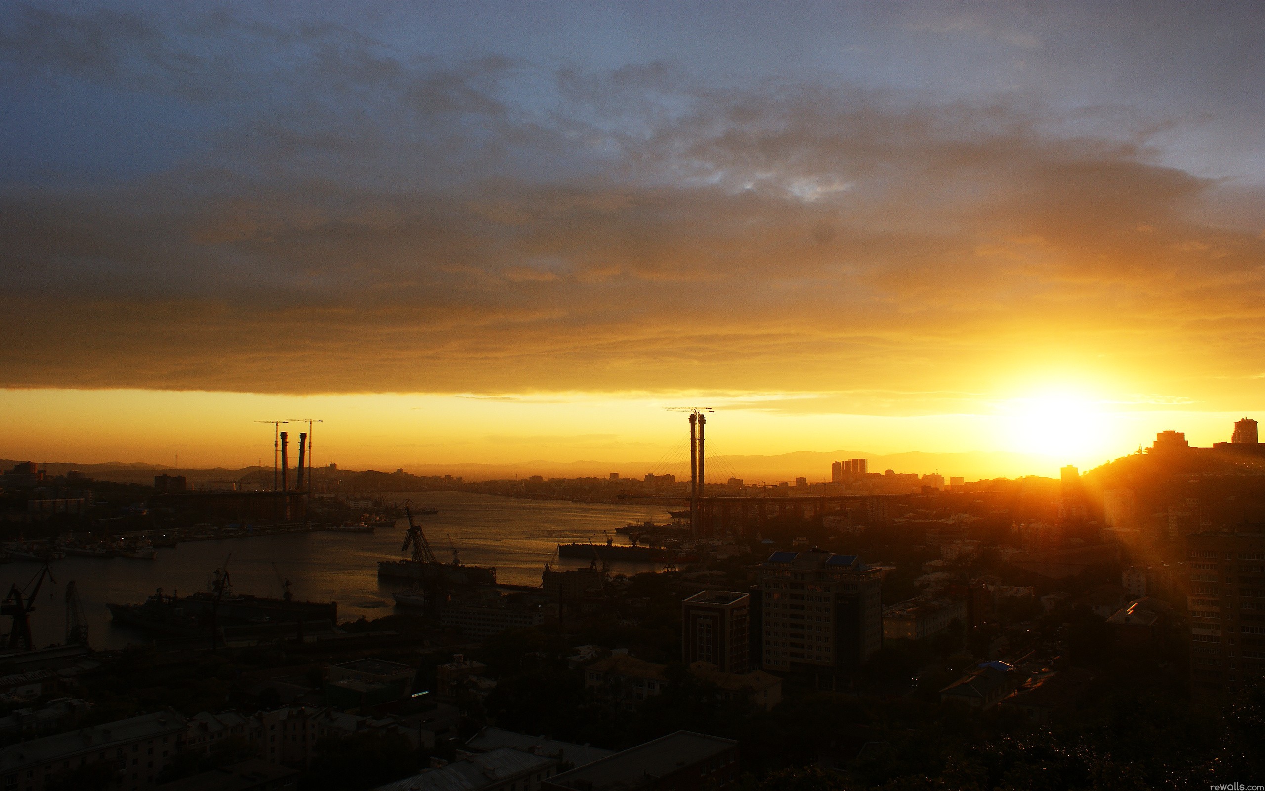 Sunset over a port city