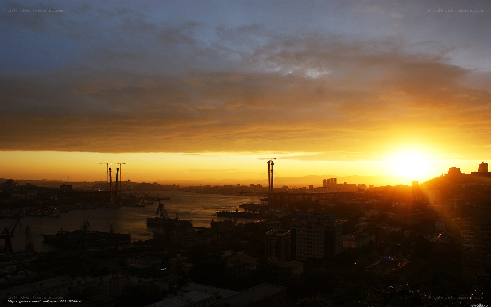 Sunset over a port city