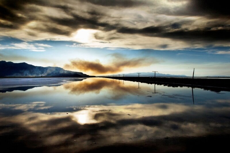 Sunset over a reflective salt flat