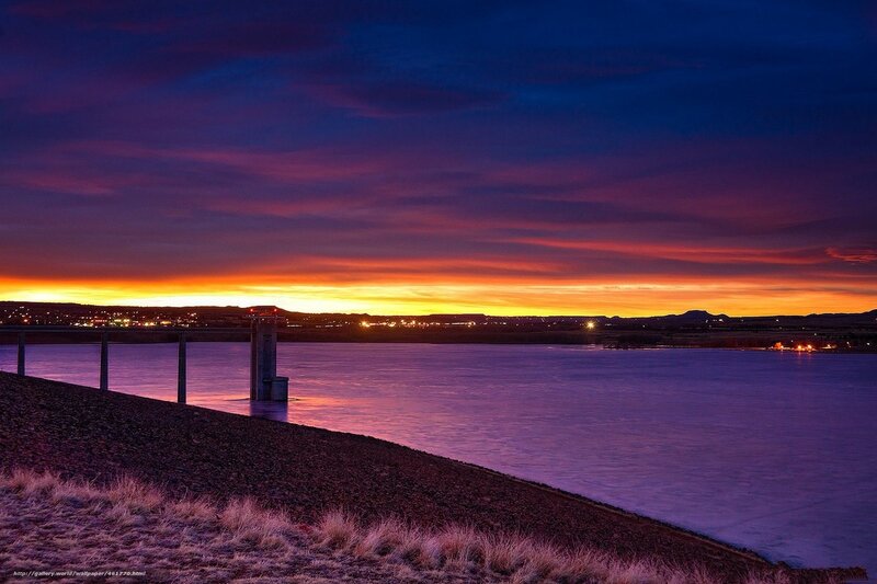 Sunset over a reservoir dam