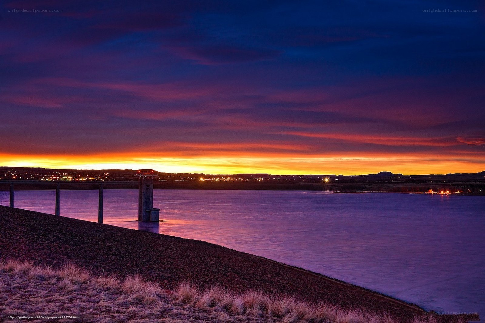 Sunset over a reservoir dam