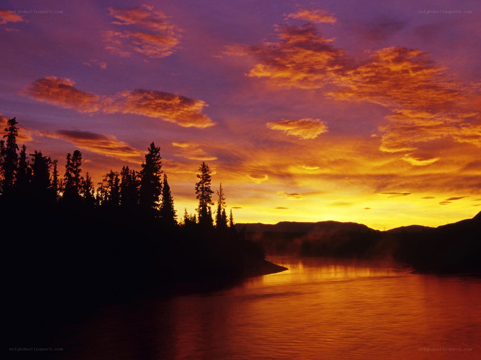 Sunset over a river at dusk