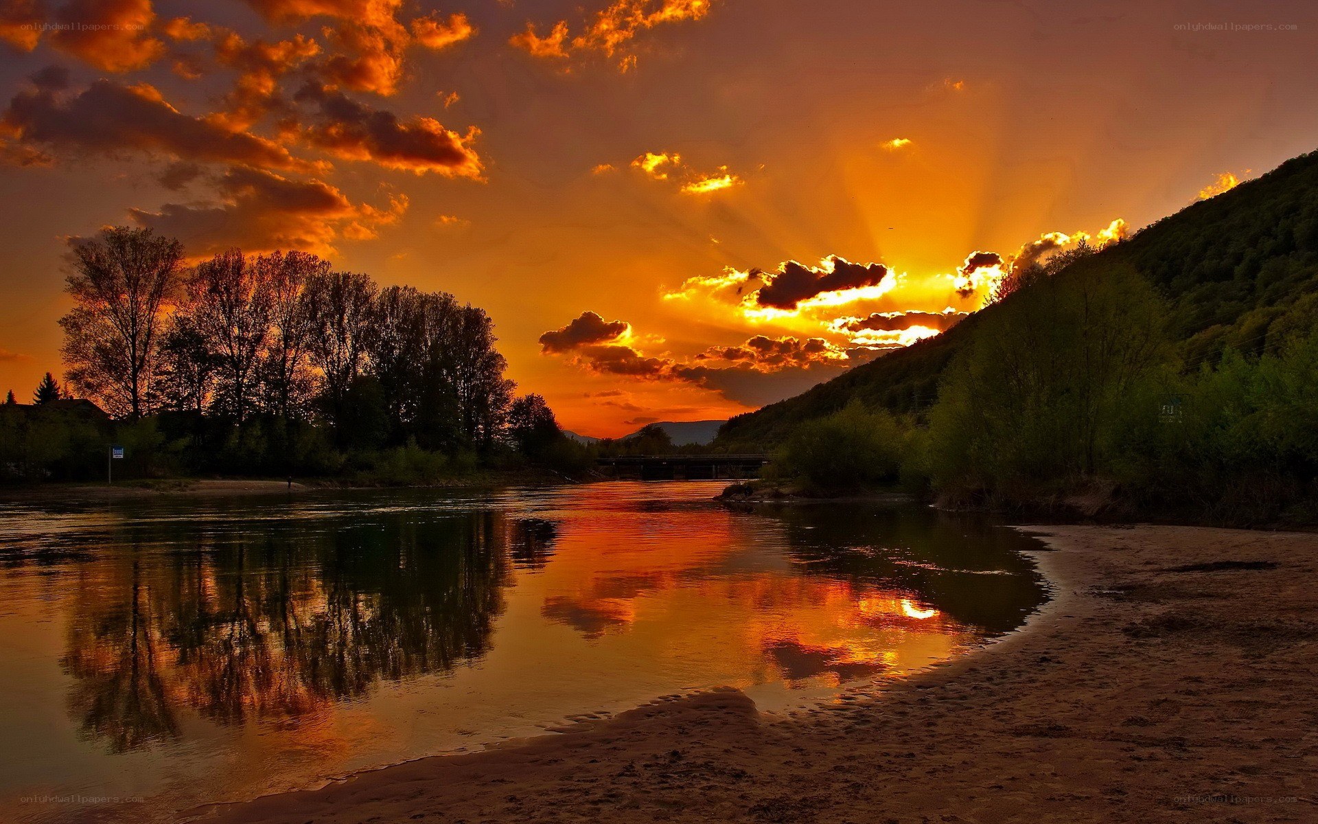 Sunset over a river at dusk