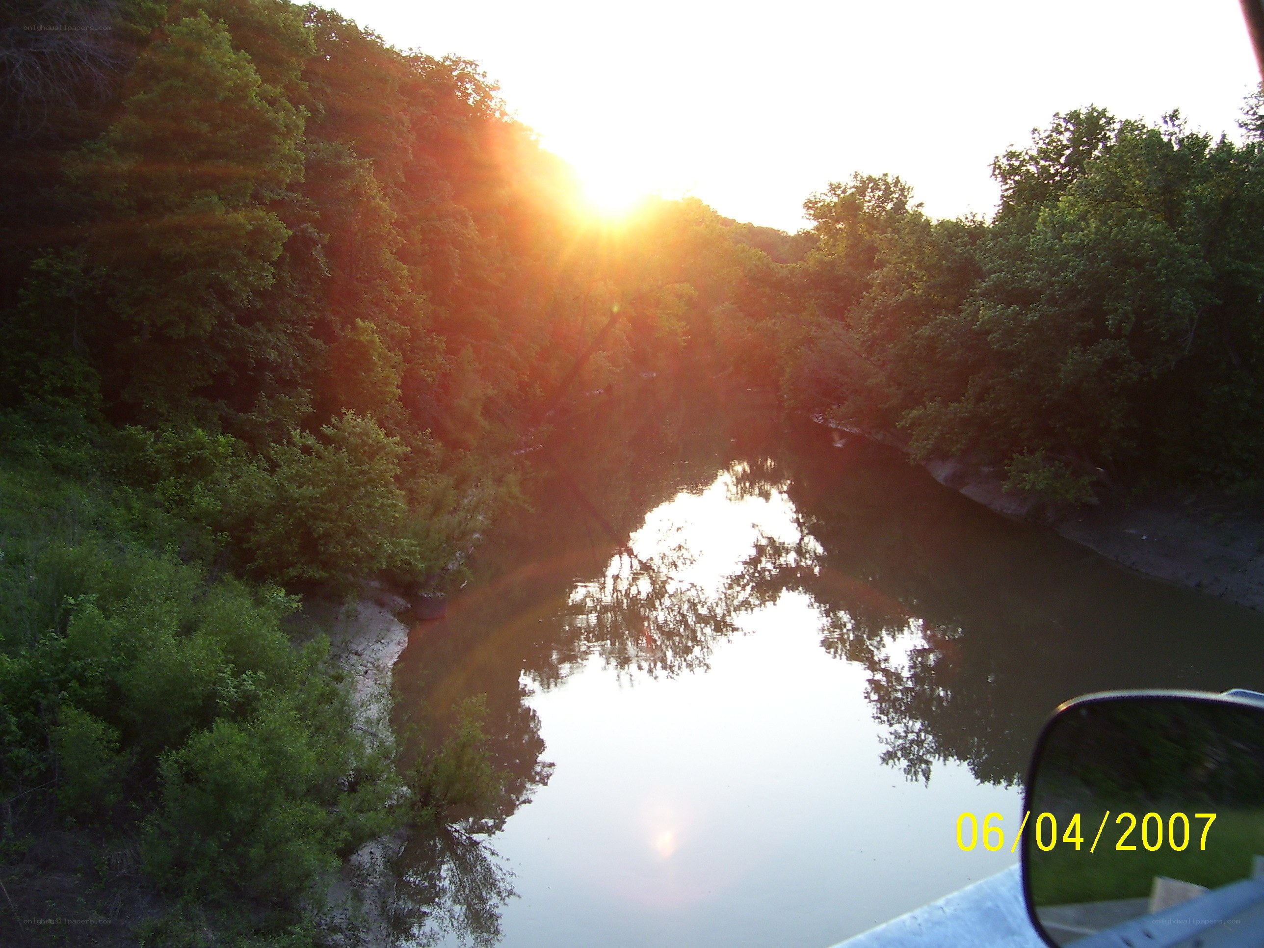 Sunset over a river at dusk