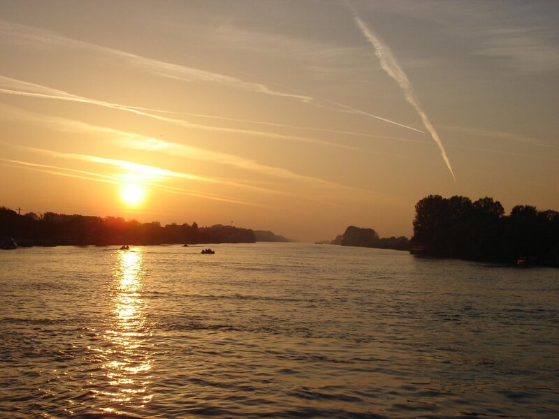 Sunset over a river at dusk