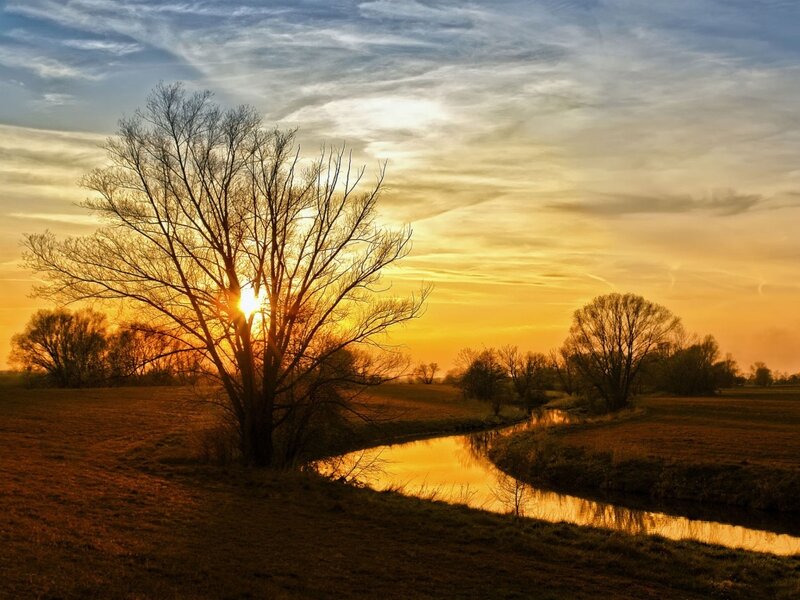 Sunset over a river at dusk