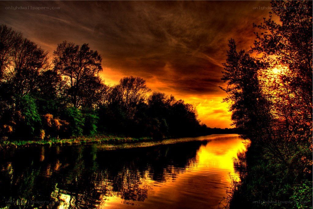 Sunset over a river at dusk