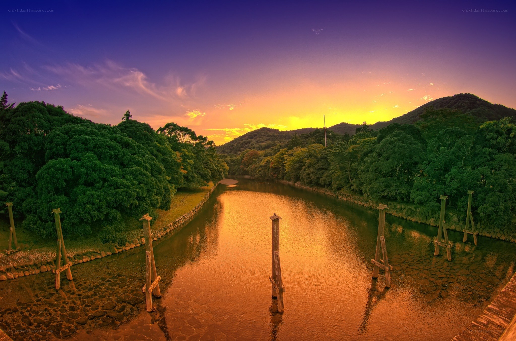 Sunset over a river at dusk