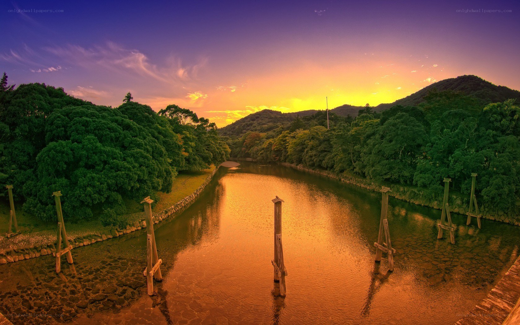 Sunset over a river at dusk