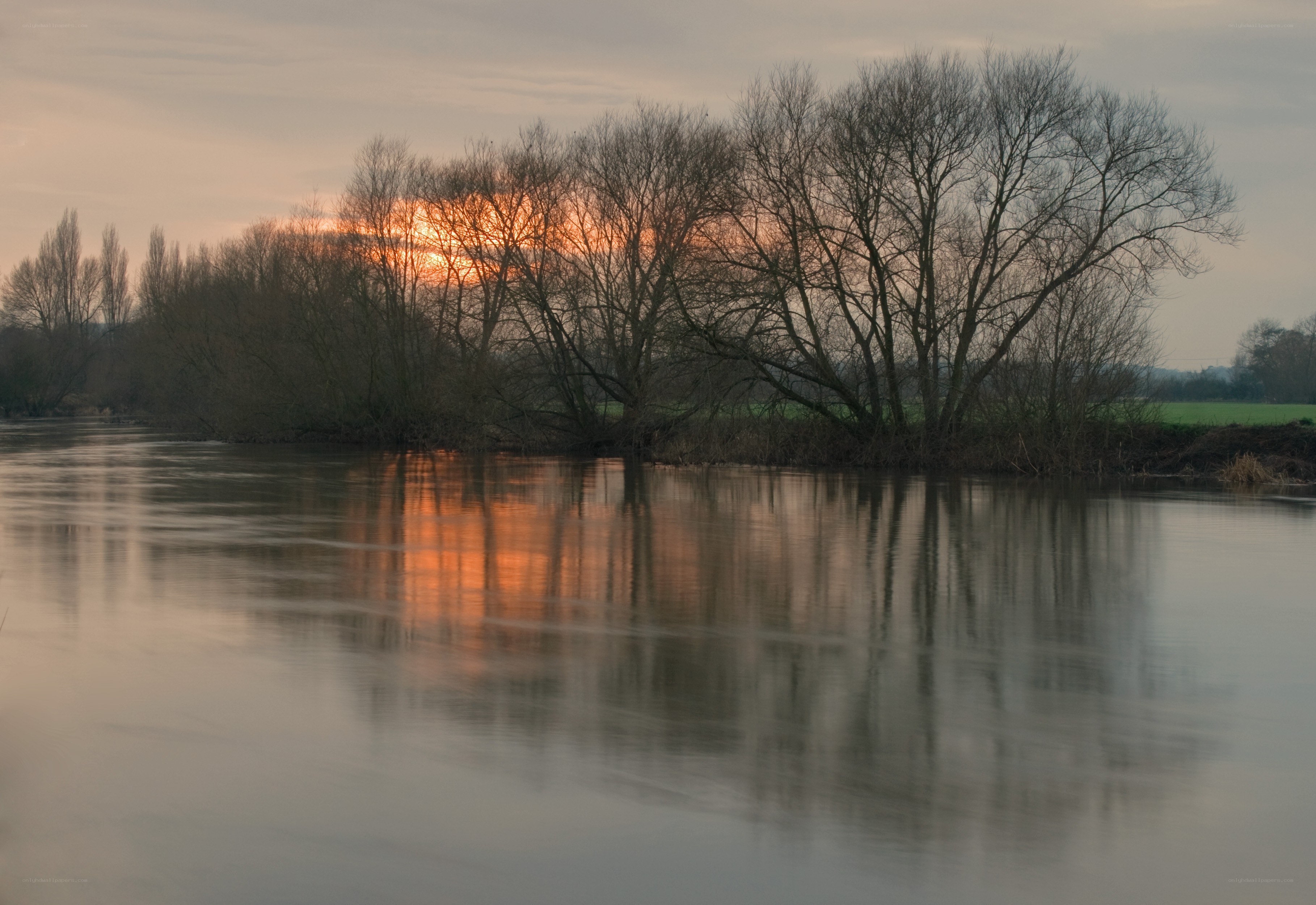 Sunset over a river at dusk