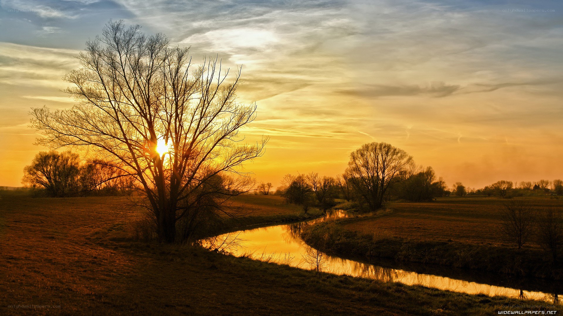Sunset over a river bend