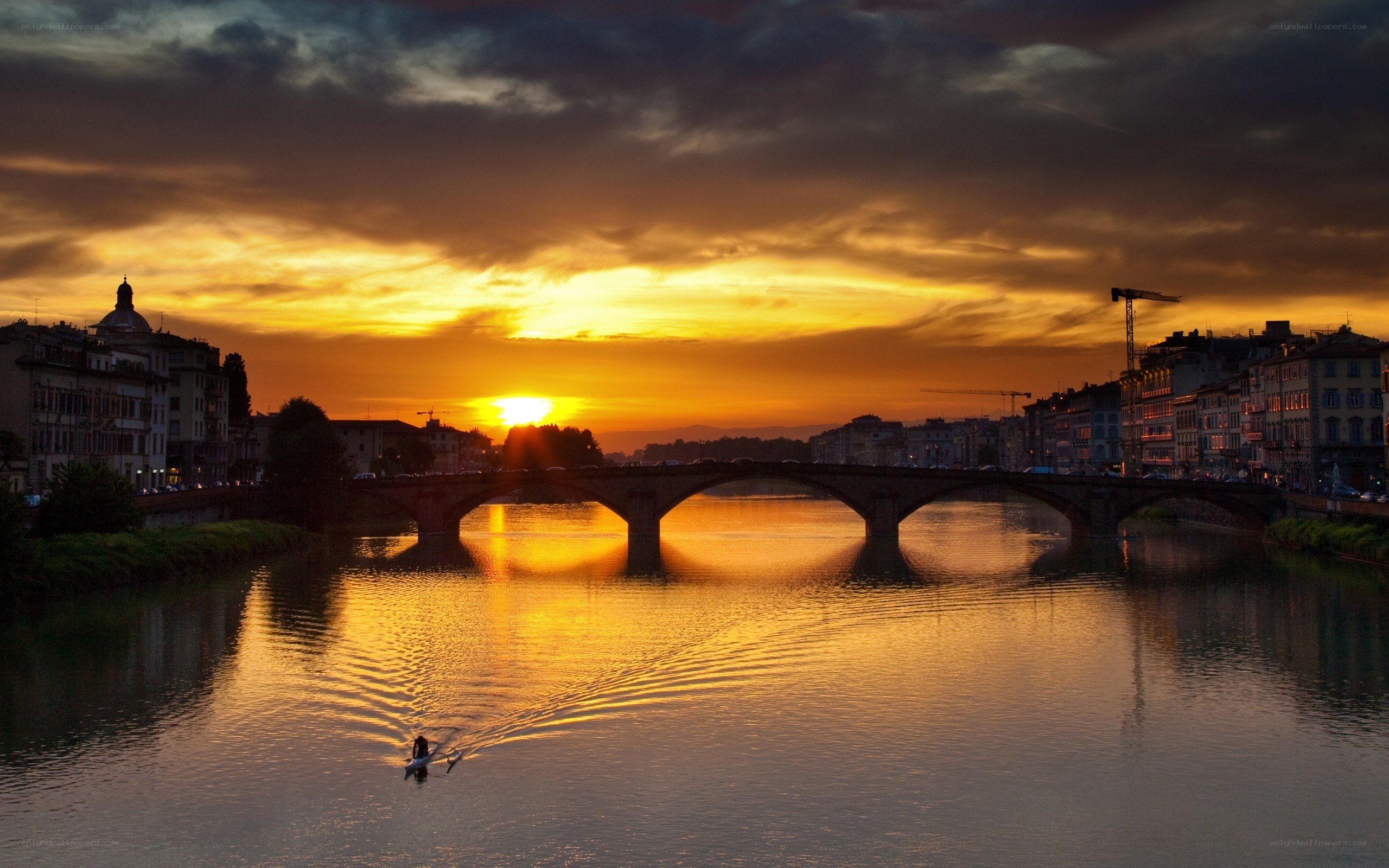 Sunset over a river bridge