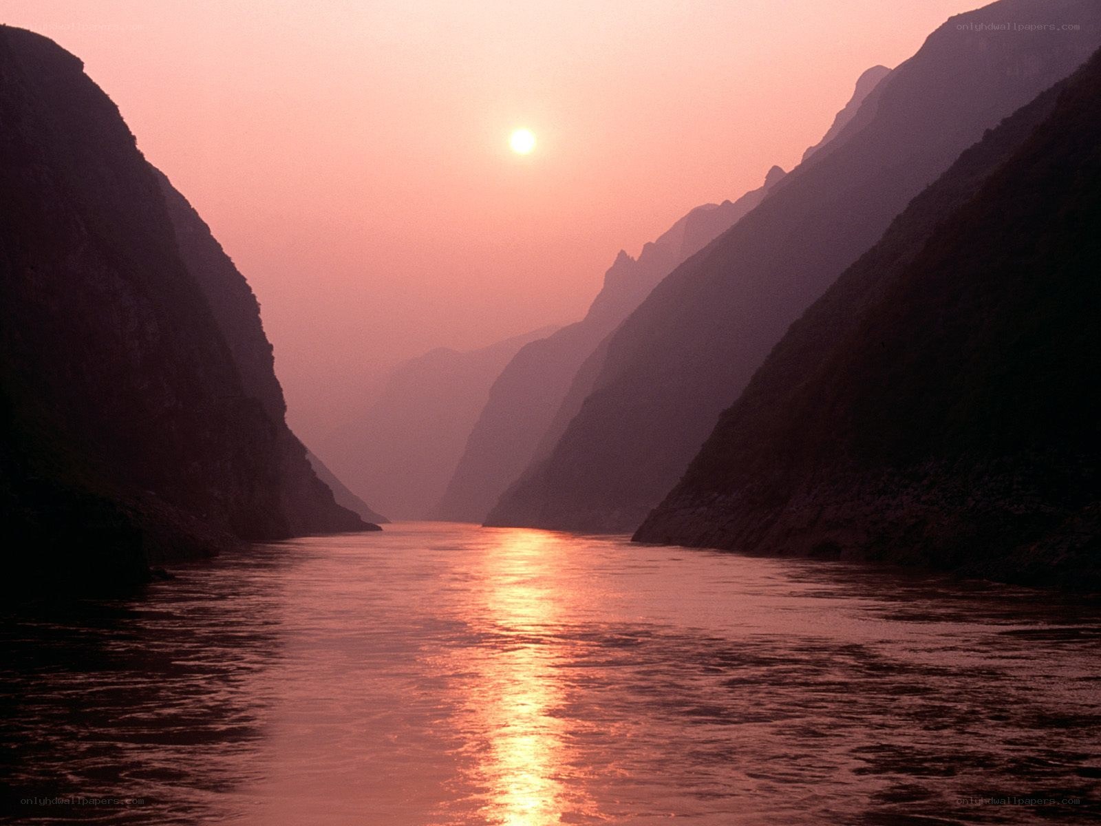 Sunset over a river canyon