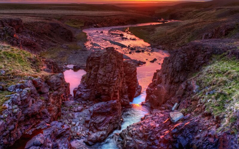 Sunset over a river canyon