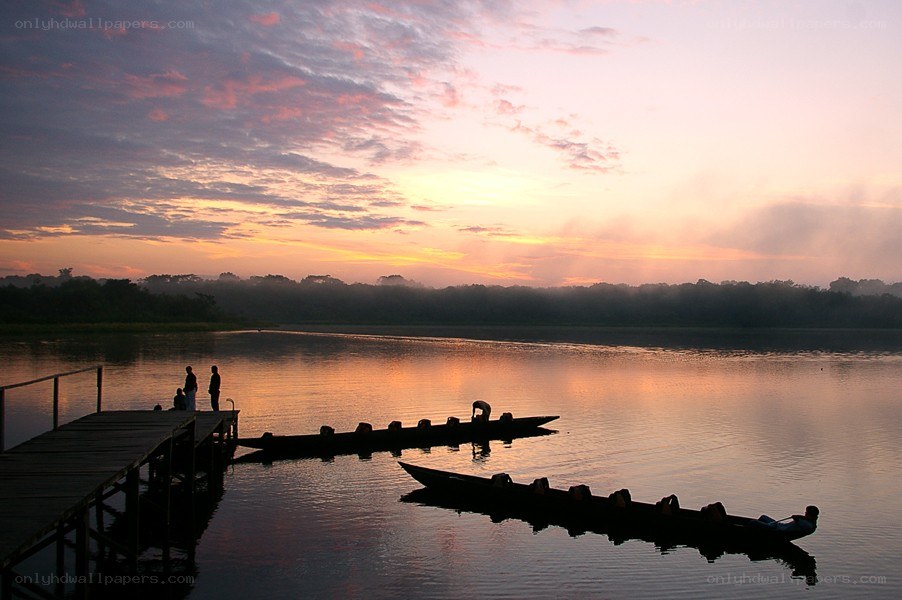 Sunset over a river dock