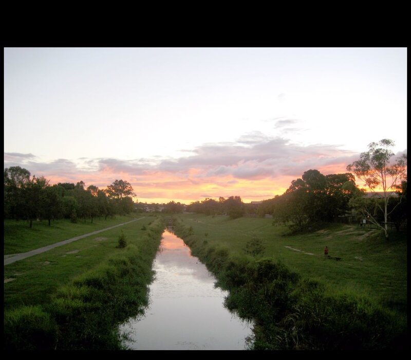 sunset over a river park
