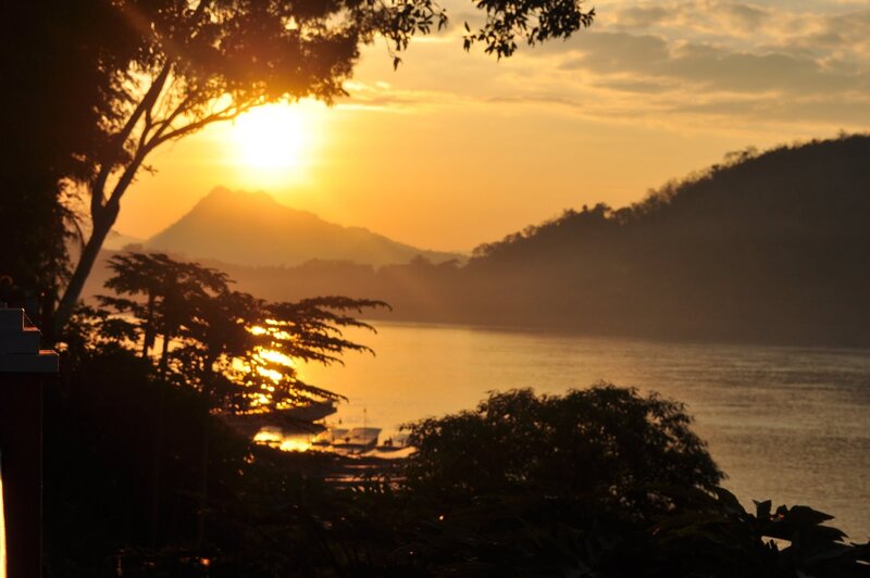 sunset over a river valley