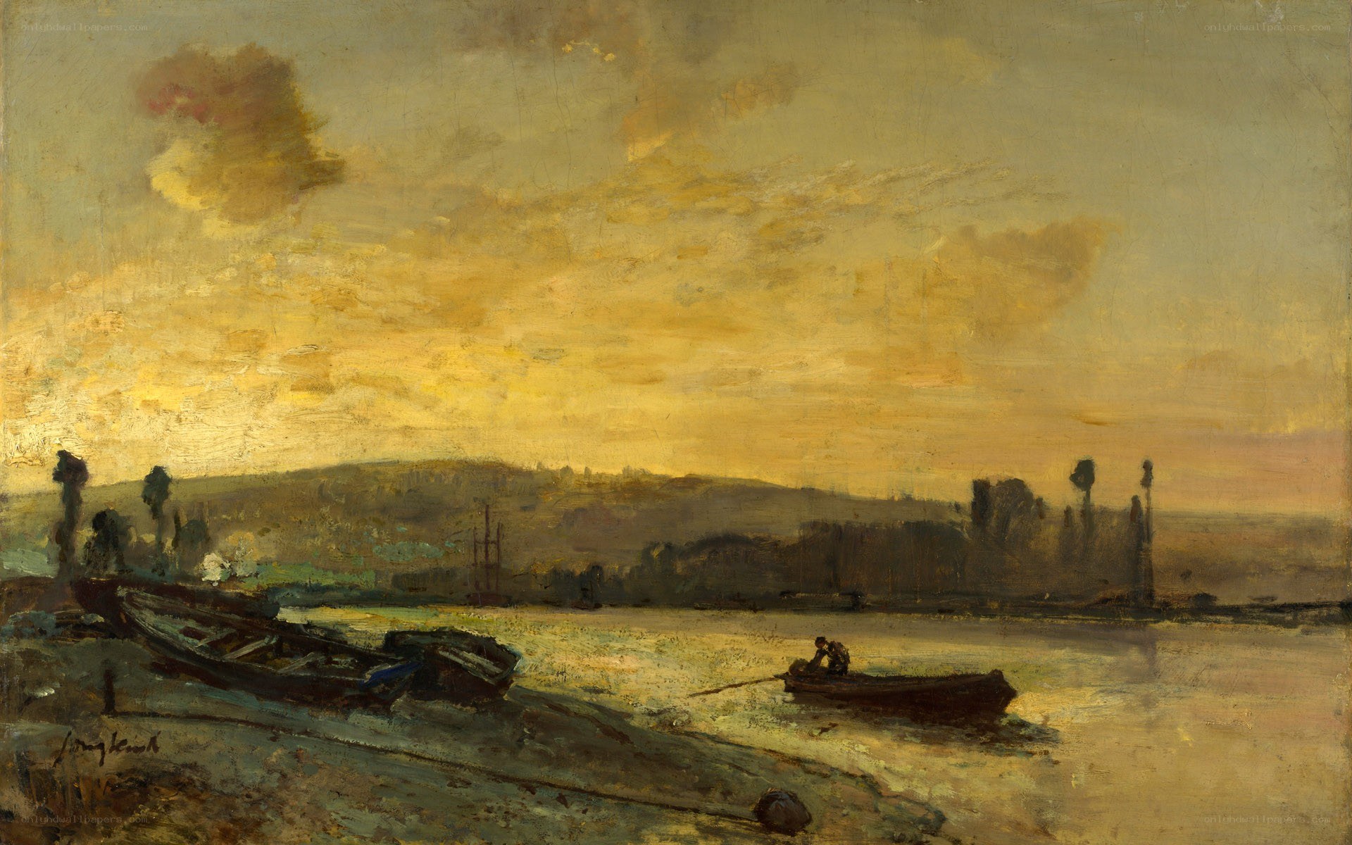 Sunset over a river with boats