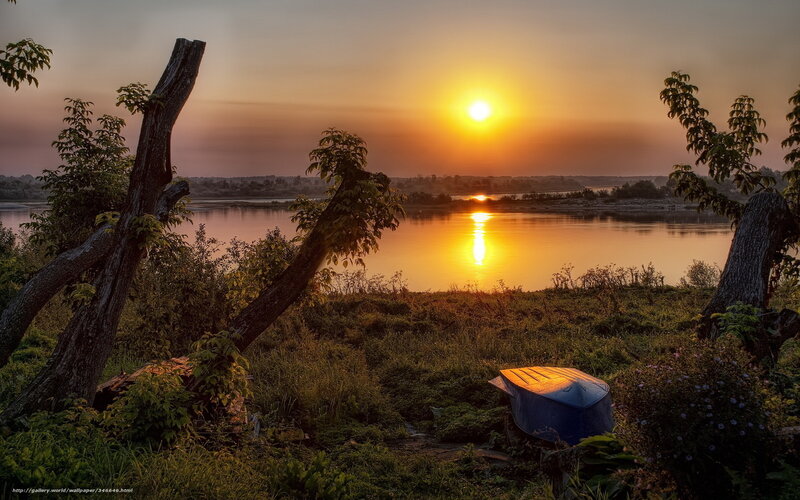 Sunset over a riverbank