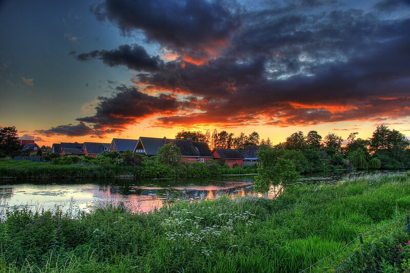 Sunset over a riverside village