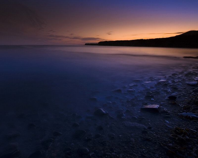 Sunset over a rocky beach