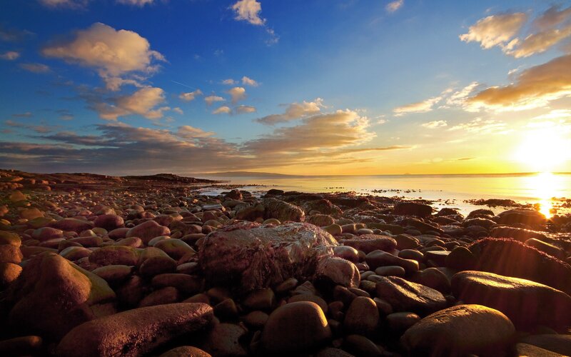 Sunset over a rocky beach