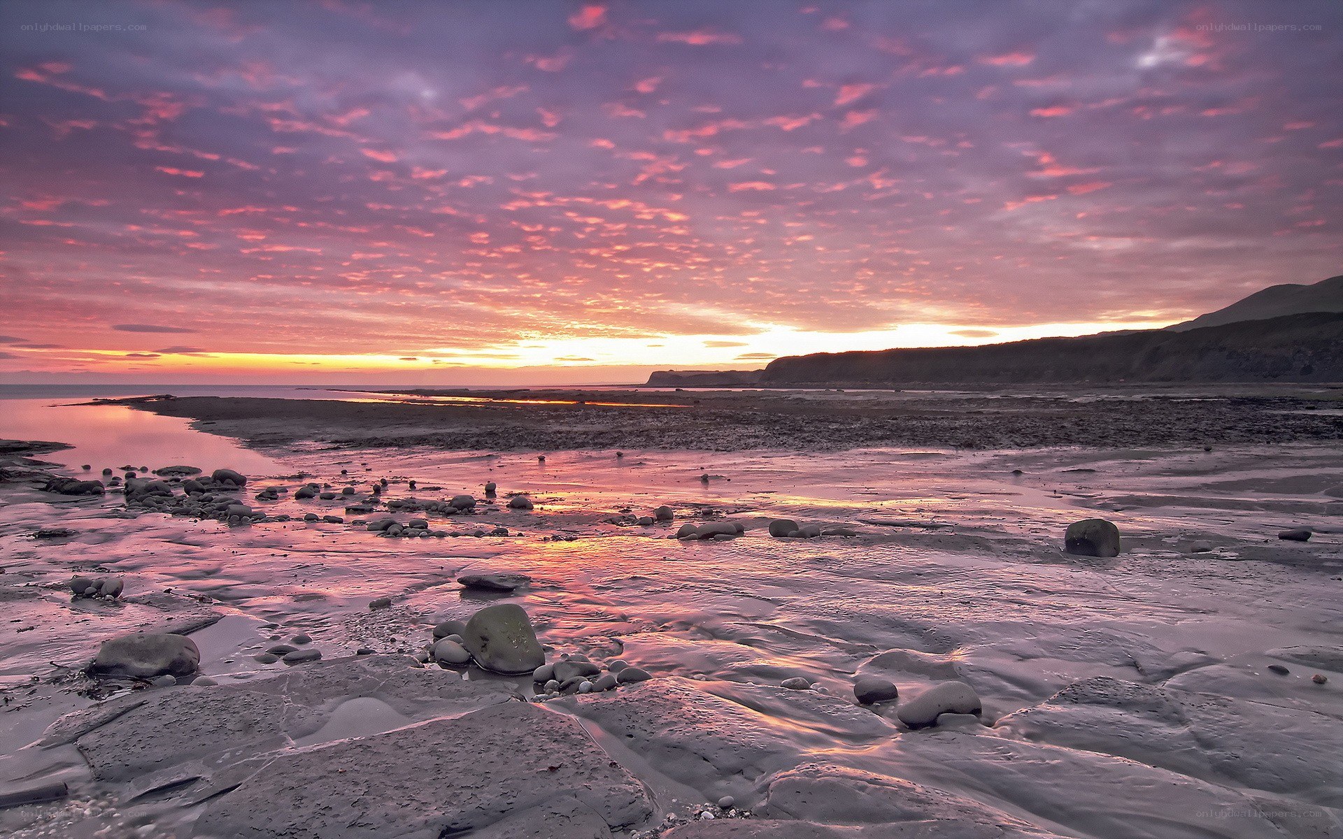 Sunset over a rocky beach