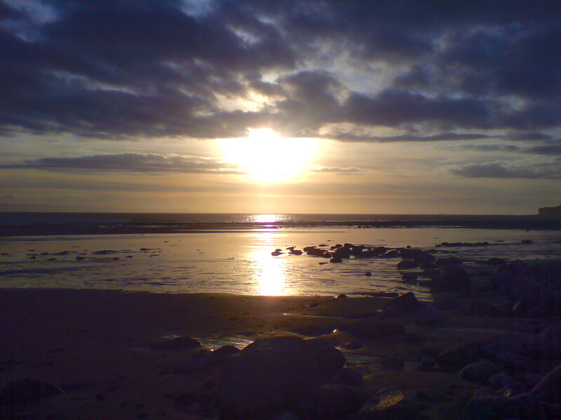 Sunset over a rocky beach