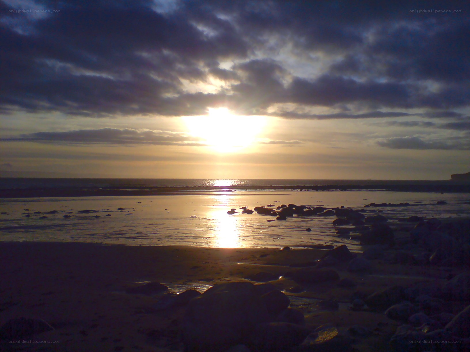 Sunset over a rocky beach
