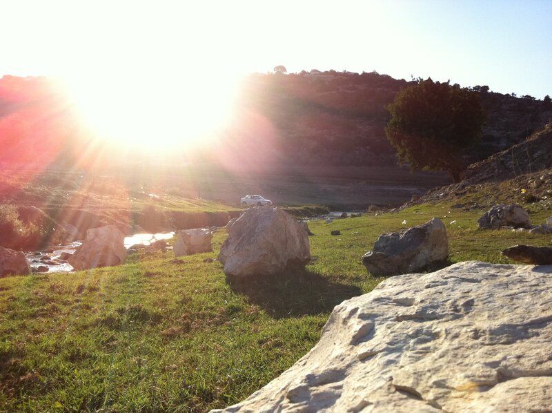 Sunset over a rocky field