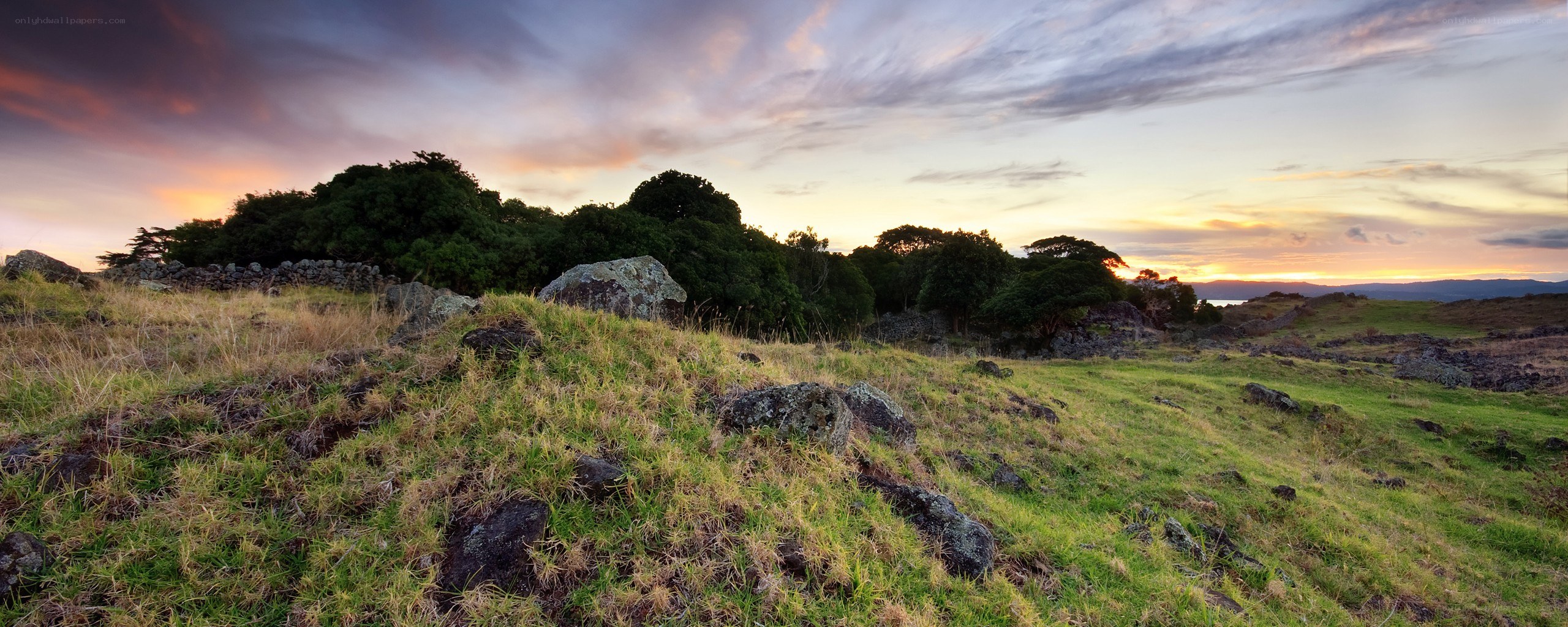 Sunset over a rocky hillside