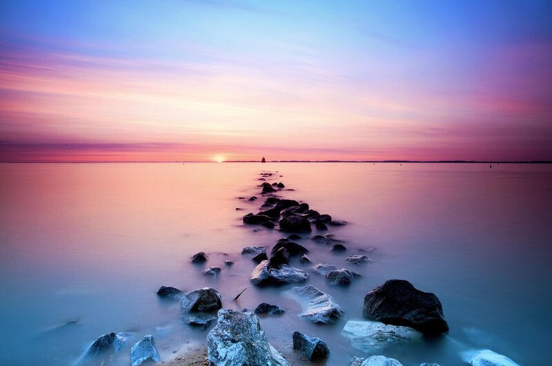 Sunset over a rocky jetty