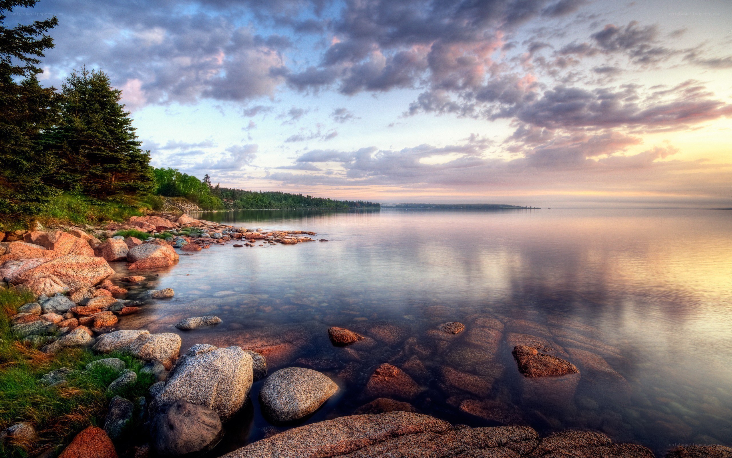 Sunset over a rocky lakeshore