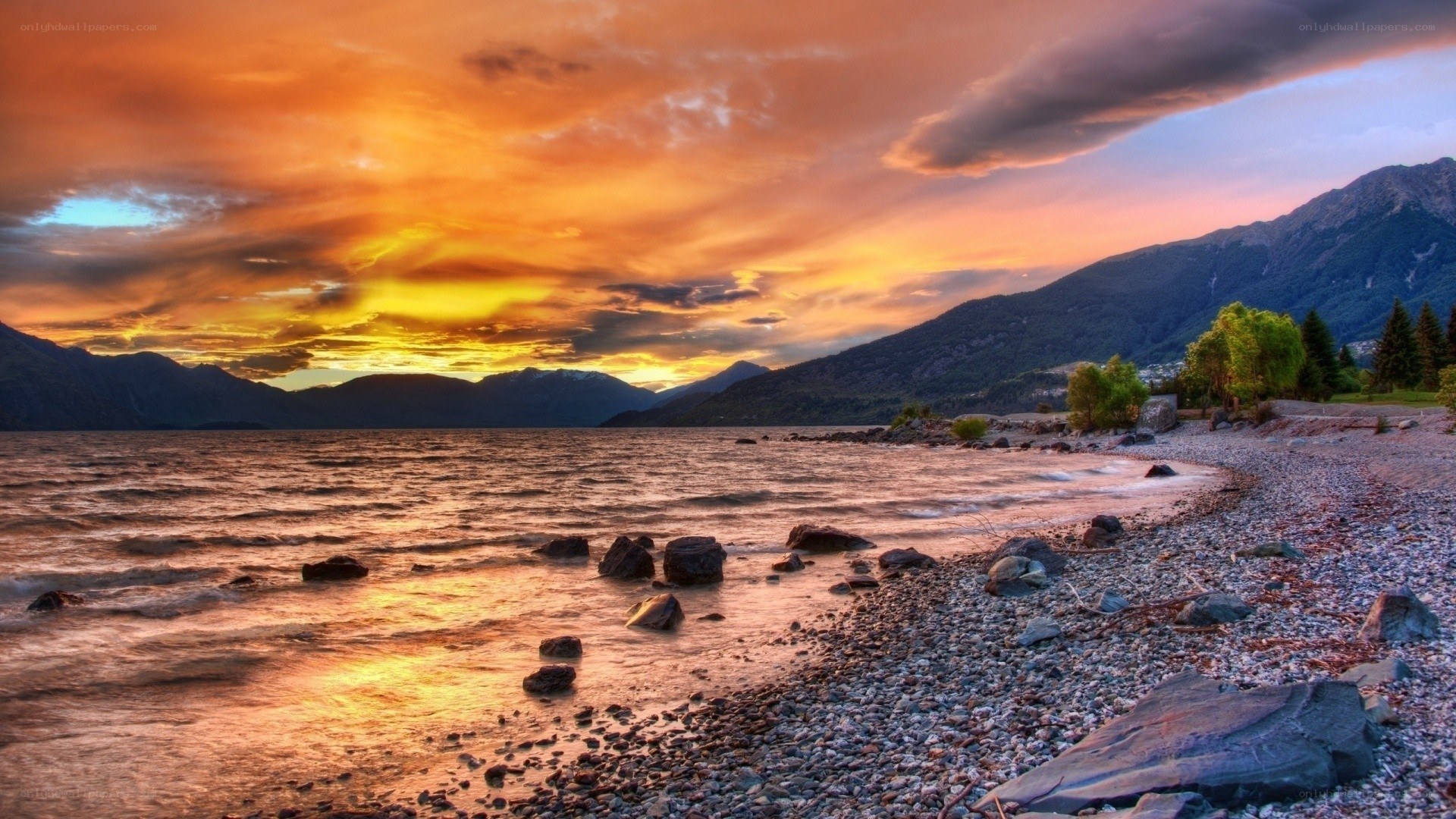 Sunset over a rocky lakeshore