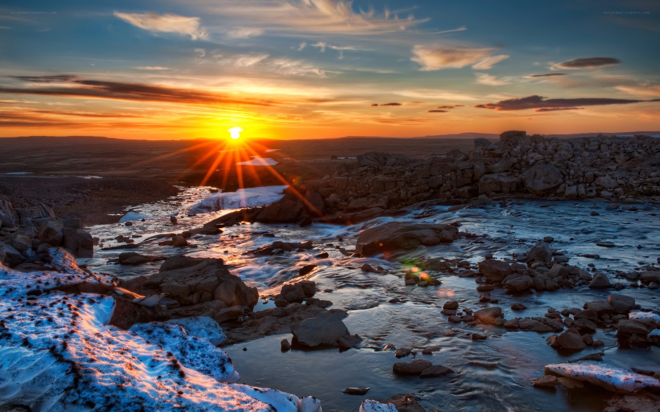 Sunset over a rocky river