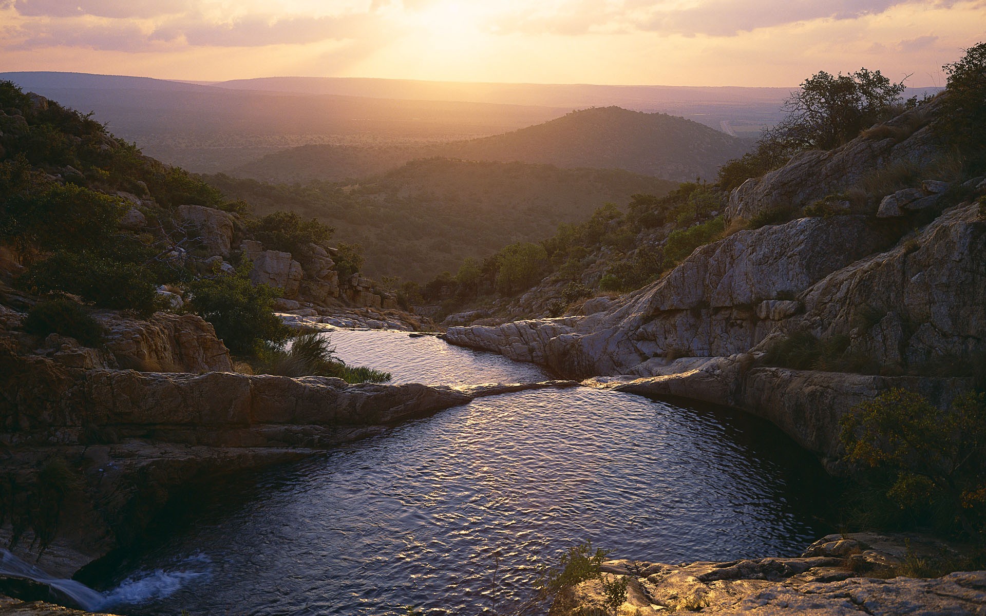 Sunset over a rocky river