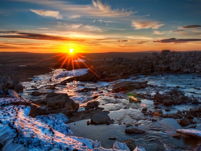 Sunset over a rocky river